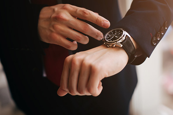 closeup of a designer watch on a businessman hand