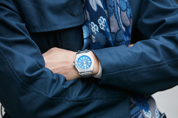 man wearing breitling watch