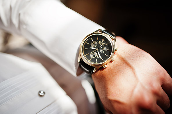man wearing luxury rolex watch