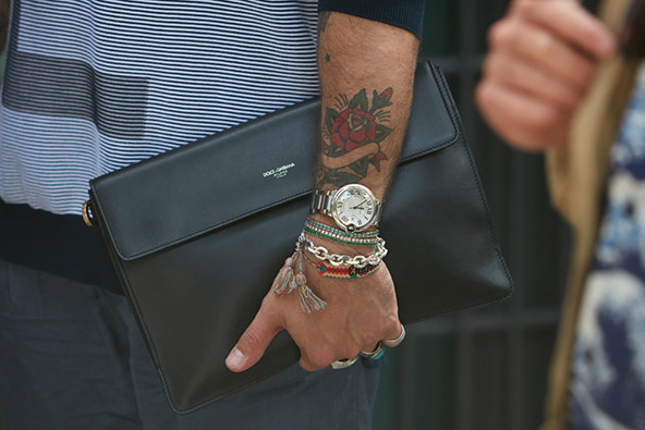  Man with Cartier Ballon Bleu watch and Dolce and Gabbana black leather bag