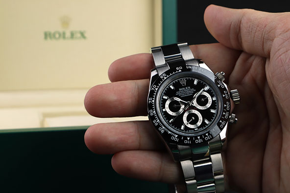 Rolex wristwatch model cosmograph daytona oyster perpetual superlative chronometer with black ceramic bezel stainless steel body