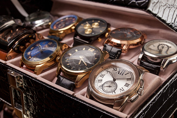 storage black leather box with a collection of watches