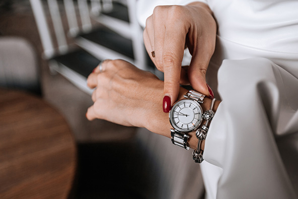 woman checks the time on her watch