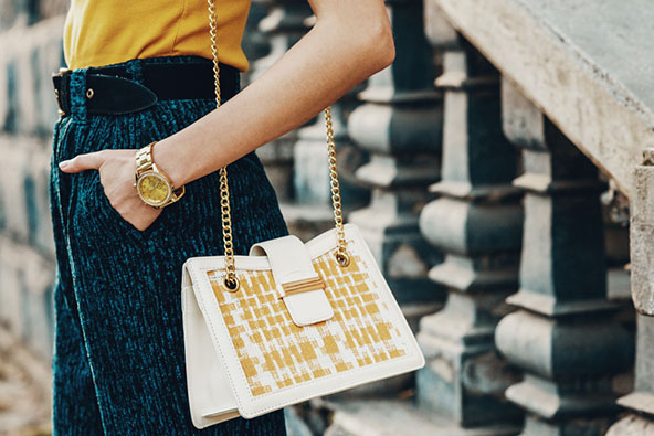 woman with stylish gold watch